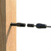 Black invisible swage terminal hidden completely inside a wood post