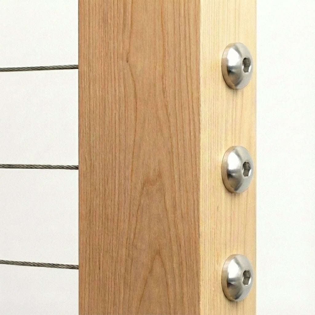 Decorative dome style round head cable railing hardware installed on wood post