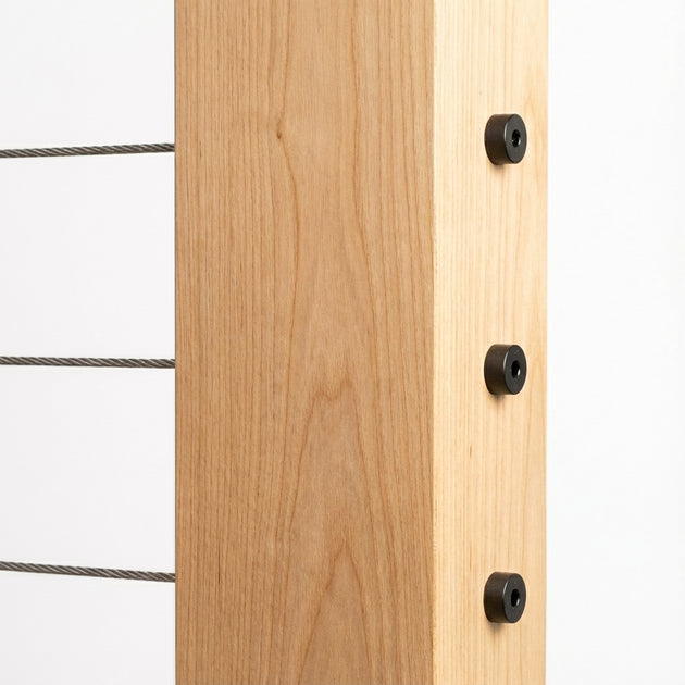 Flush and seamless look of black invisible cable railing hardware installed in wood post