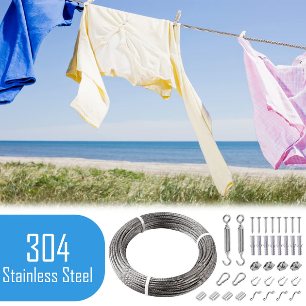 Heavy duty stainless steel clothesline drying wet laundry and quilts outdoors.