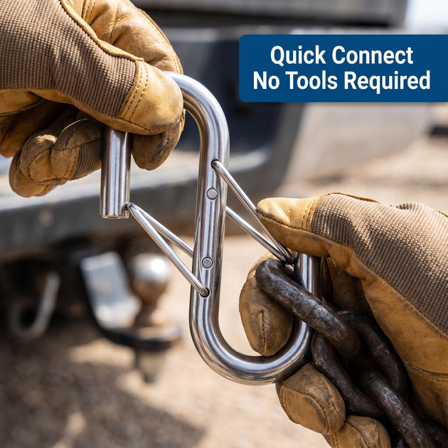 Close-up of gloved hands using a stainless steel spring snap hook carabiner for a quick, tool-free rigging connection on a metal bracket.