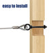 Close-up demonstrating the quick and easy direct surface installation of a black lag thread screw eye hook into a solid wooden post.