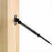 Close-up of the surface mount base plate secured to a wood post for cable railing installation.