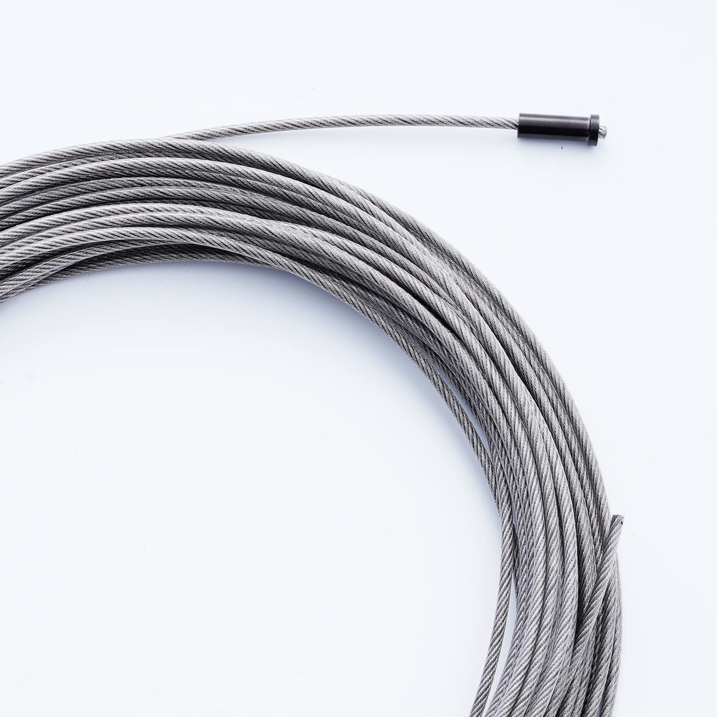 Stainless steel wire rope threaded through a black T316 wood post protective sleeve